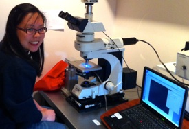 Grace looking through the Leica microscope